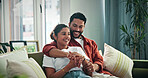 Happy, relax and couple holding hands on sofa for bonding, funny conversation or healthy marriage. Joke, people and laugh together with hug in home for comic chat, weekend break or relationship trust
