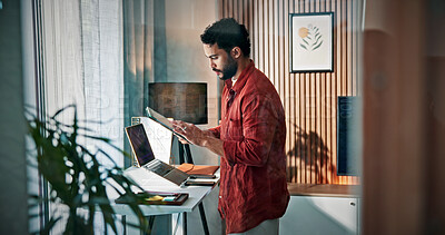 Buy stock photo Scroll, online and man with tablet in home office, proofreading or planning for magazine publication. Creative, journalist and person with tech for article, review and remote work with standing desk