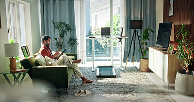 Buy stock photo Relax, tablet and watching with man on sofa in home for streaming service, series app or calm. Movie subscription website, online film review and weekend break with person in living room of apartment
