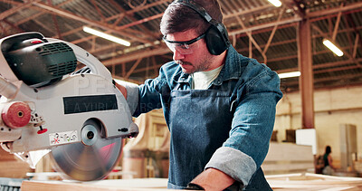 Buy stock photo Bandsaw, eyewear and woodworking with man in warehouse for manufacturing or production process. Earmuffs, ppe and sawing machine with person in carpentry plant to resize lumber or timber for project