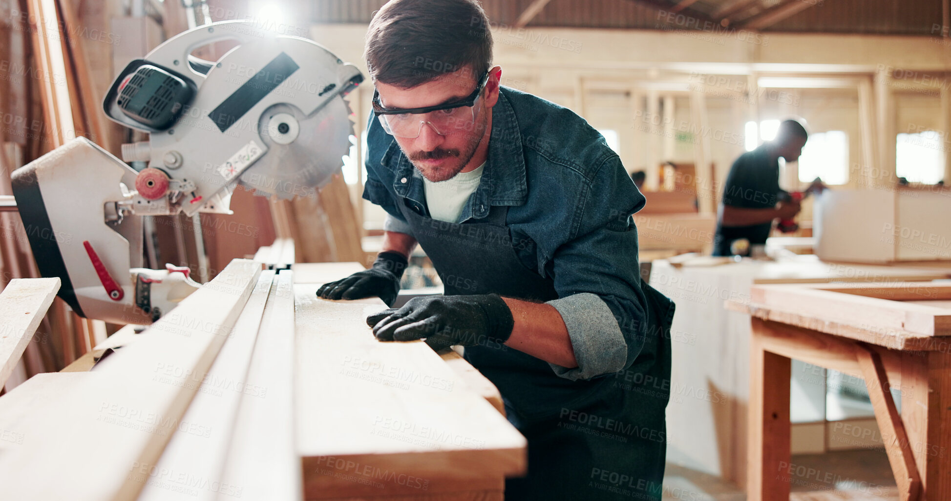 Buy stock photo Carpenter, plank and man with bandsaw in workshop, precision and accuracy for construction process. Material preparation, woodwork and person with machine for furniture production, planning and craft