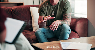 Buy stock photo Hands, anxiety and man on sofa with therapist for help, advice or feedback on mental health. Assessment, psychiatry and male person with depression in therapy session for wellness at clinic.
