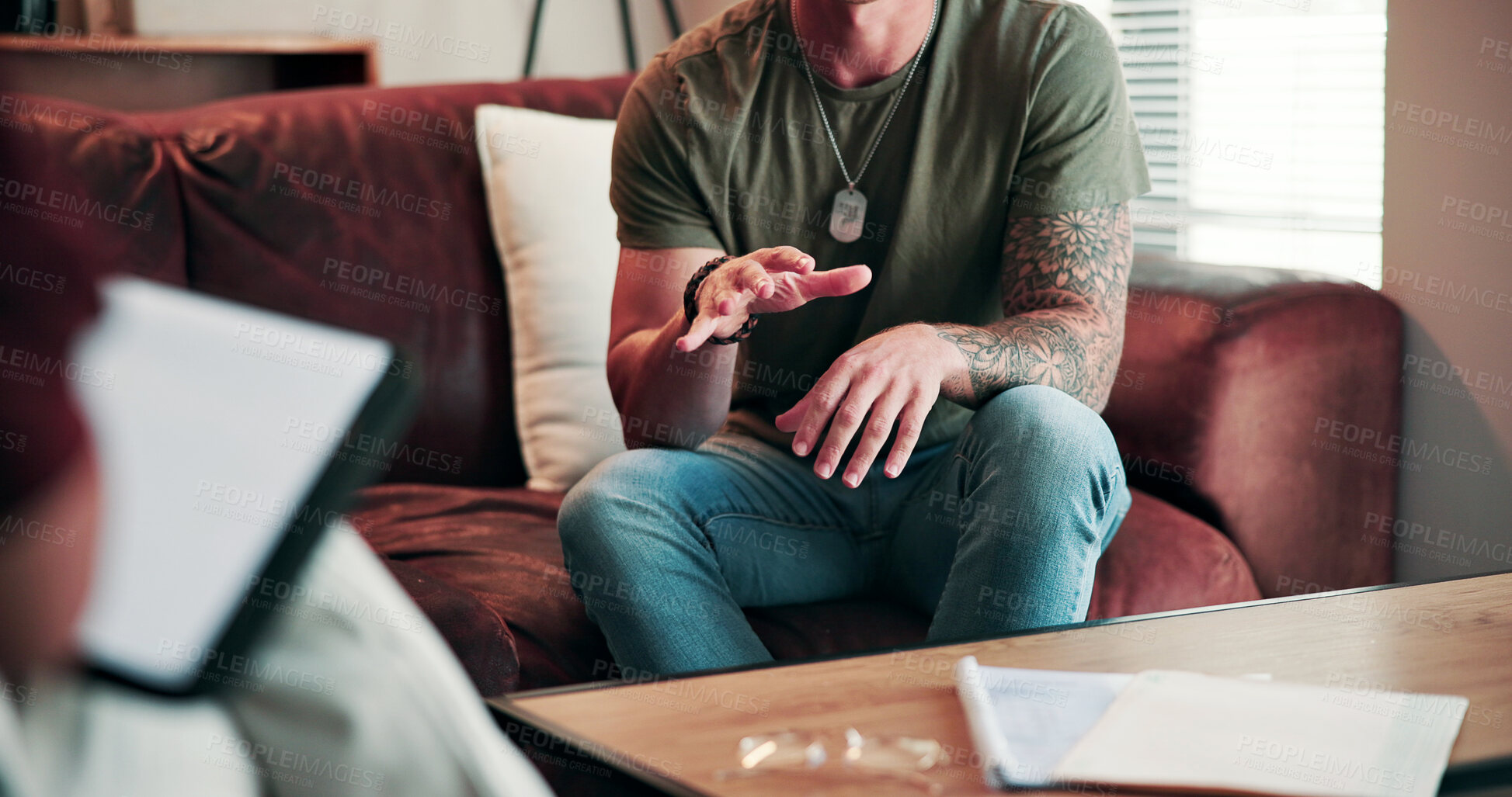 Buy stock photo Hands, anxiety and man on sofa with therapist for help, advice or feedback on mental health. Assessment, psychiatry and male person with depression in therapy session for wellness at clinic.