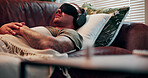Headphones, therapy or man with blindfold on couch, sensory deprivation or anxiety counseling technique. Relaxation training, psychology or person with mindfulness for ptsd, therapeutic audio or tech