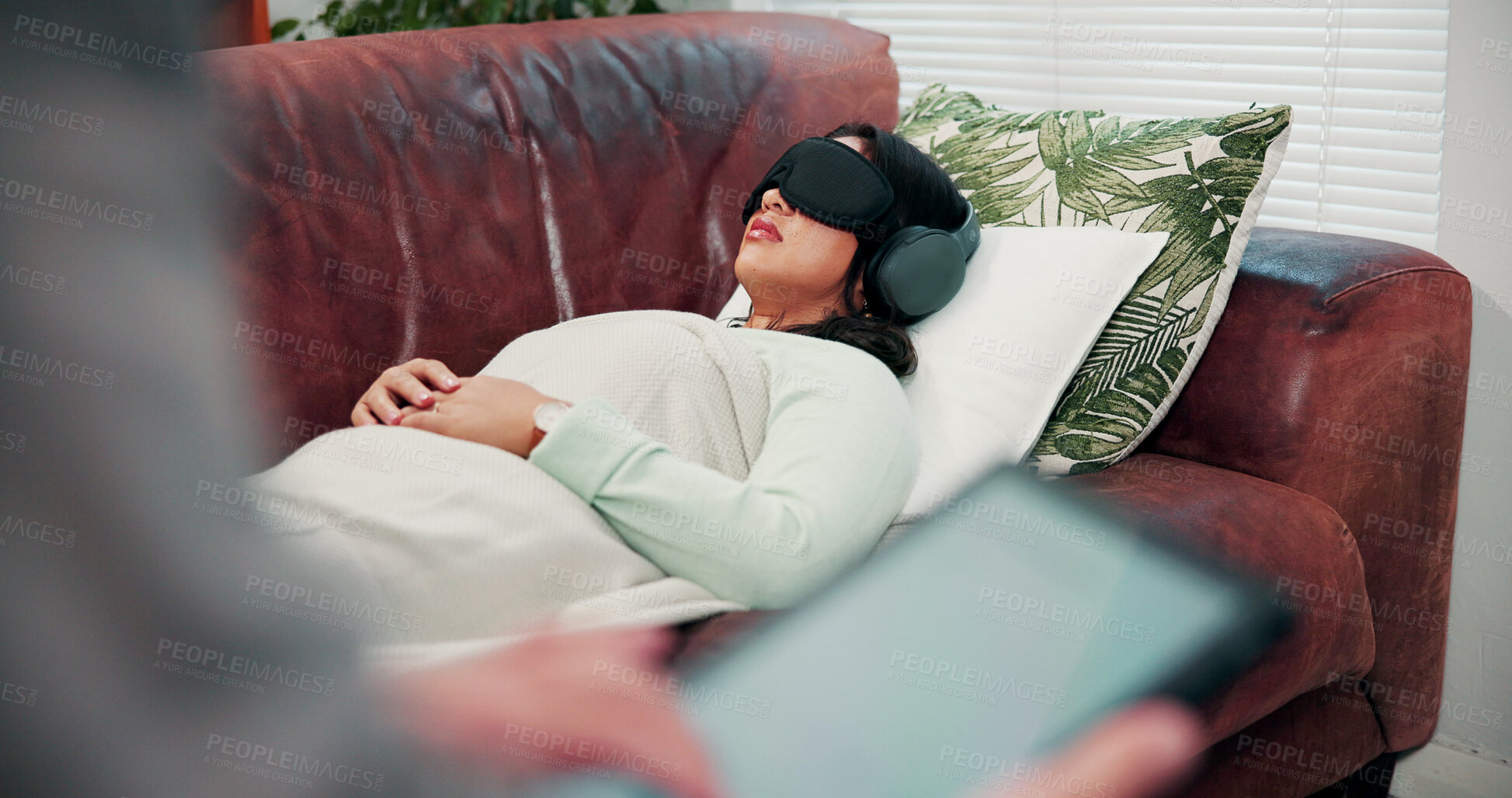 Buy stock photo Psychology, counseling and woman on sofa with headphones, relax or psychedelic treatment. Mental health, psilocybin therapy and person with sleep mask for anxiety, stress or alternative medicine