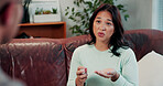 Woman, pills and question on sofa for consultation, communication or healthcare for wellness. Patient, physician and pharmaceutical discussion with medication, drugs or supplement for prescription