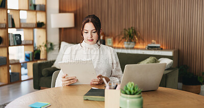 Buy stock photo Woman, clipboard and reading with laptop for project draft, editing article and creative process in home. Remote work, freelance writer and tech for proofreading with document or blog post feedback