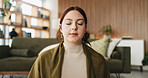 Woman, relax and peace in living room with meditation, spiritual awareness and breathing for wellness. Zen, person and mindfulness in tranquil home with reflection, holistic health and stress relief.