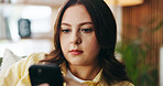 Serious, woman and relax with phone at house for social media, browsing website and chatting. Female person, scroll and reading with mobile app for text message, communication and online notification