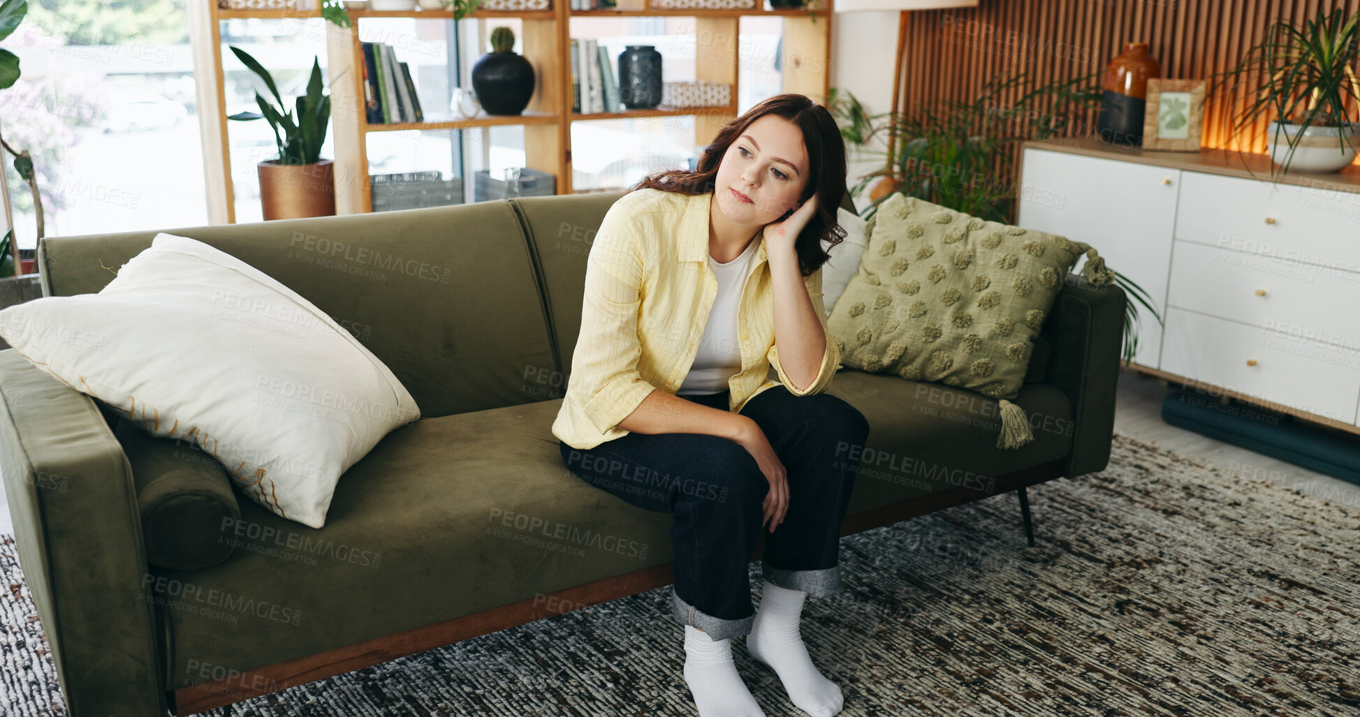 Buy stock photo Thinking, bored and woman on sofa in home for reflection, nostalgia and daydreaming on weekend. Apartment, remember and person on couch with memory, thoughtful and wondering for planning day on break