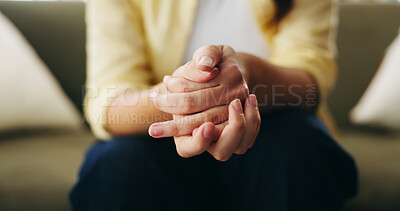 Buy stock photo Hands, anxiety and woman on sofa in home with stress for mistake, mental health or bad news. Nervous, thinking and female person with uncertain feeling for trauma, conflict or worry in living room.