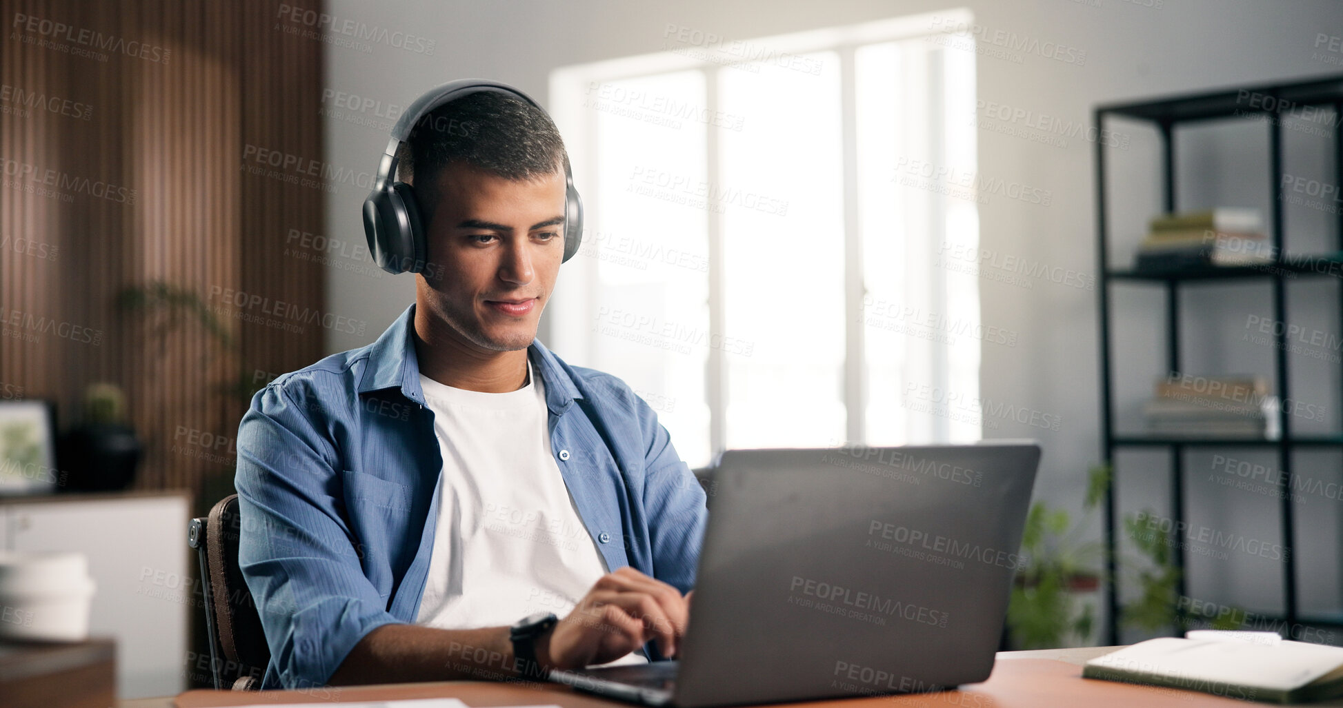 Buy stock photo Headphones, laptop and man in home with remote work for creative project with listening to music. Audio tech, computer and male editor streaming playlist for freelance publishing in apartment.
