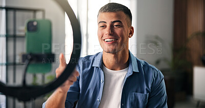 Buy stock photo Happy man, influencer and chat with ring light in house for content creation, smile and video on phone. Person, point and live streaming on web, mobile app and post on social network at apartment