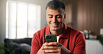 Man, smile and typing in living room with phone, social media update or text message on dating app. Happy, person relax or scroll in home with browse website, online chat or entertainment on weekend.