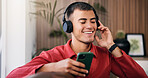 Happy man, headphones and phone on sofa in home for audio, streaming service and relax in living room. Person, smartphone and listen to music with smile, subscription and scroll for song at apartment