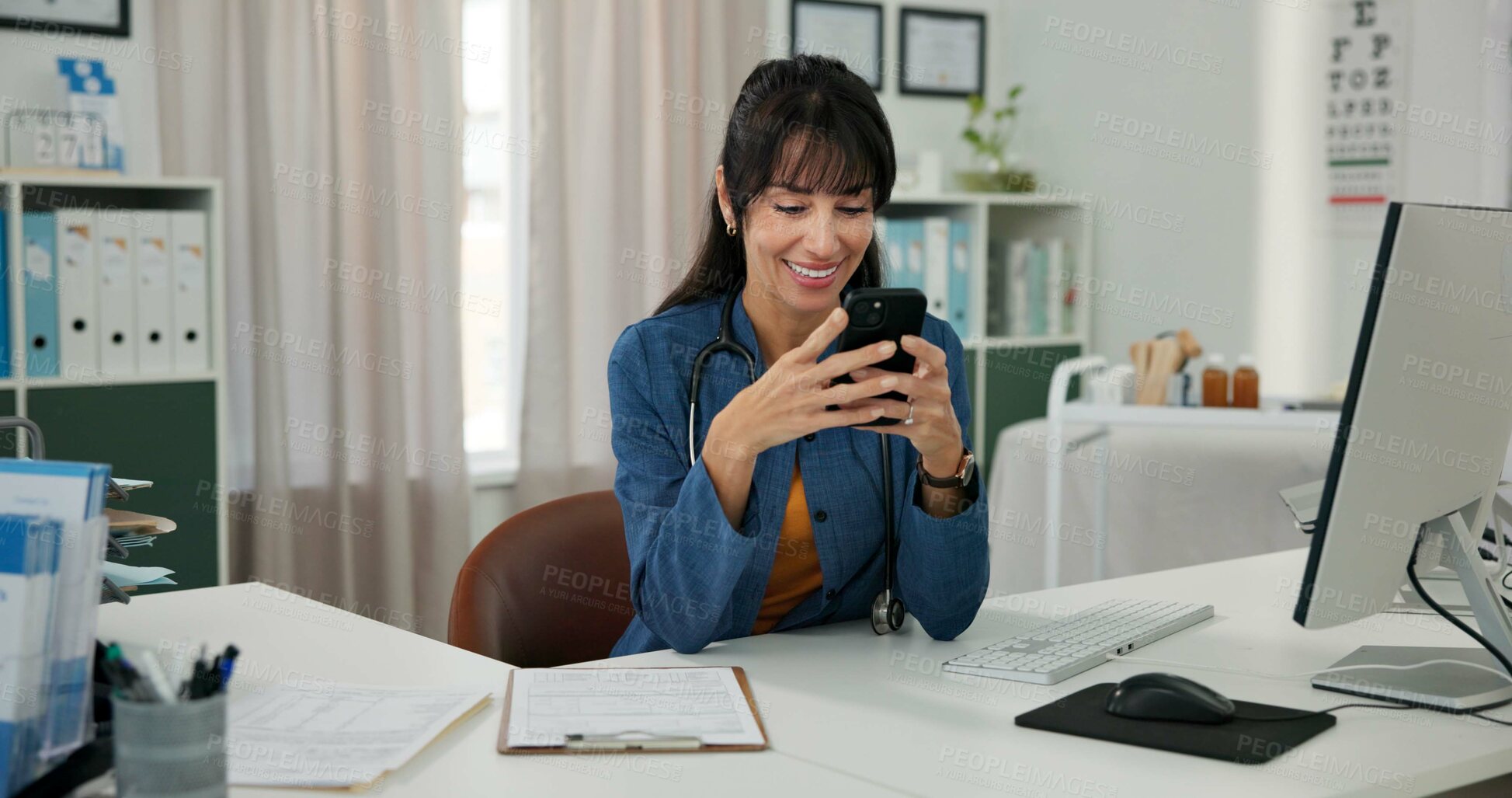 Buy stock photo Computer, doctor and woman in office with phone for patient review, medical research or diagnosis. Healthcare, clinic and mature person with digital tech, report and online message for telehealth
