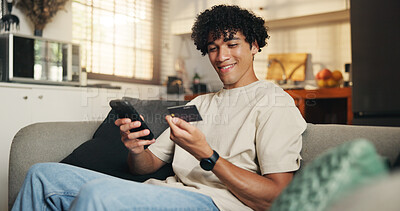 Buy stock photo Happy man, phone and credit card on couch in home with sale, code or choice with financial freedom. Person, smartphone and smile with digital banking, mobile app and fintech for ecommerce at house