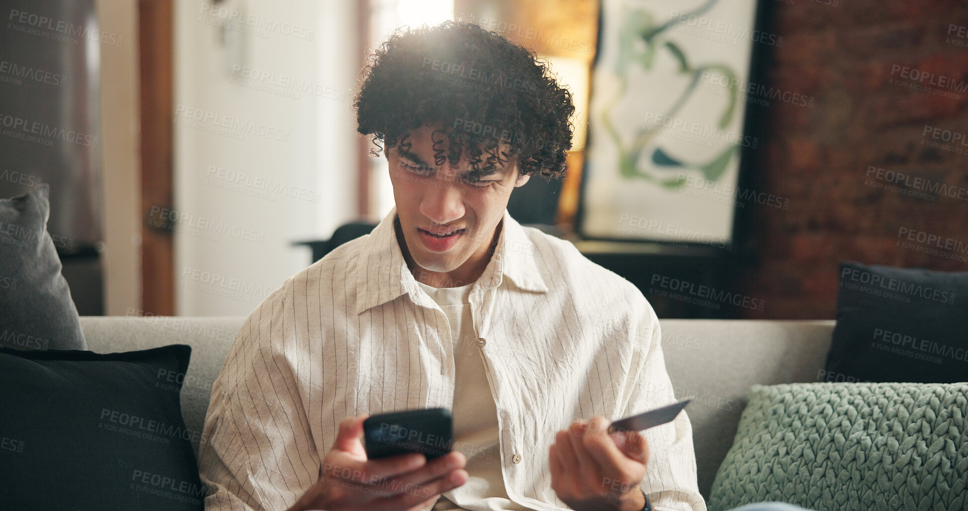 Buy stock photo Man, phone and stress with credit card on couch in home with error, mistake or decline payment. Person, smartphone and confused with digital banking, mobile app and fintech for ecommerce at house
