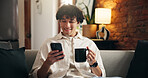 Coffee, relax and man on sofa with phone for social media, online message and chat in home. Weekend, smile and person on smartphone for internet, connection and notification on mobile app with drink