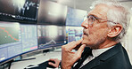 Data, thinking and trading with business man in office to monitor stock market for investment. Finance, planning and statistics charts with mature broker in workplace for portfolio management