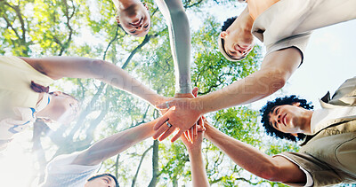 Buy stock photo Below, hand stack and huddle with friends outdoor together for solidarity, support or unity. Diversity, success and trees with group of people in nature for collaboration, motivation or teamwork