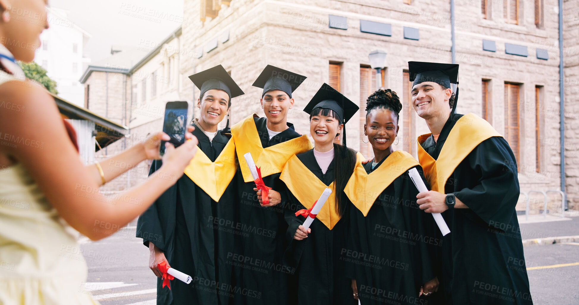 Buy stock photo Friends, phone and photo for graduation with diploma for success, education and diversity in city. Group, people and college student with milestone, celebration and hug with certificate for goals