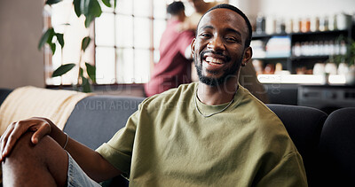 Buy stock photo Portrait, relax and smile of man on sofa in home living room for reunion, social gathering or weekend. Break, comfortable and visit with happy person at friends apartment for satisfaction or wellness