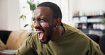 Black man, celebration and USA flag on sofa with face paint, cheers and goals in global soccer competition. Person, happy and excited with success, winning or watching tv for football at apartment