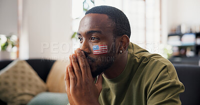 Buy stock photo Man, american and sport with hope in home for live entertainment, match or soccer game on sofa. Male person, football fan or thinking with anticipation for tournament, score or watching tv in house
