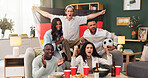 Excited, fans and people with Germany flag in lounge, watching tv or happiness for football success. Group, together and friends with alcohol for live stream, home and celebration for sport match