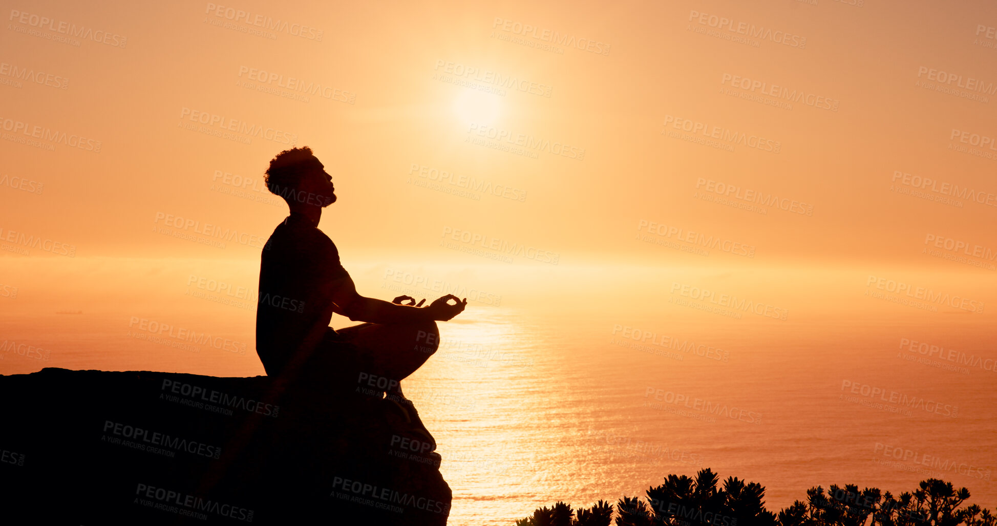Buy stock photo Sunrise, meditation and man on mountain by ocean for reflection, mindfulness and peace in morning. Silhouette, nature and person with calm for mental health, wellness and balance with horizon space