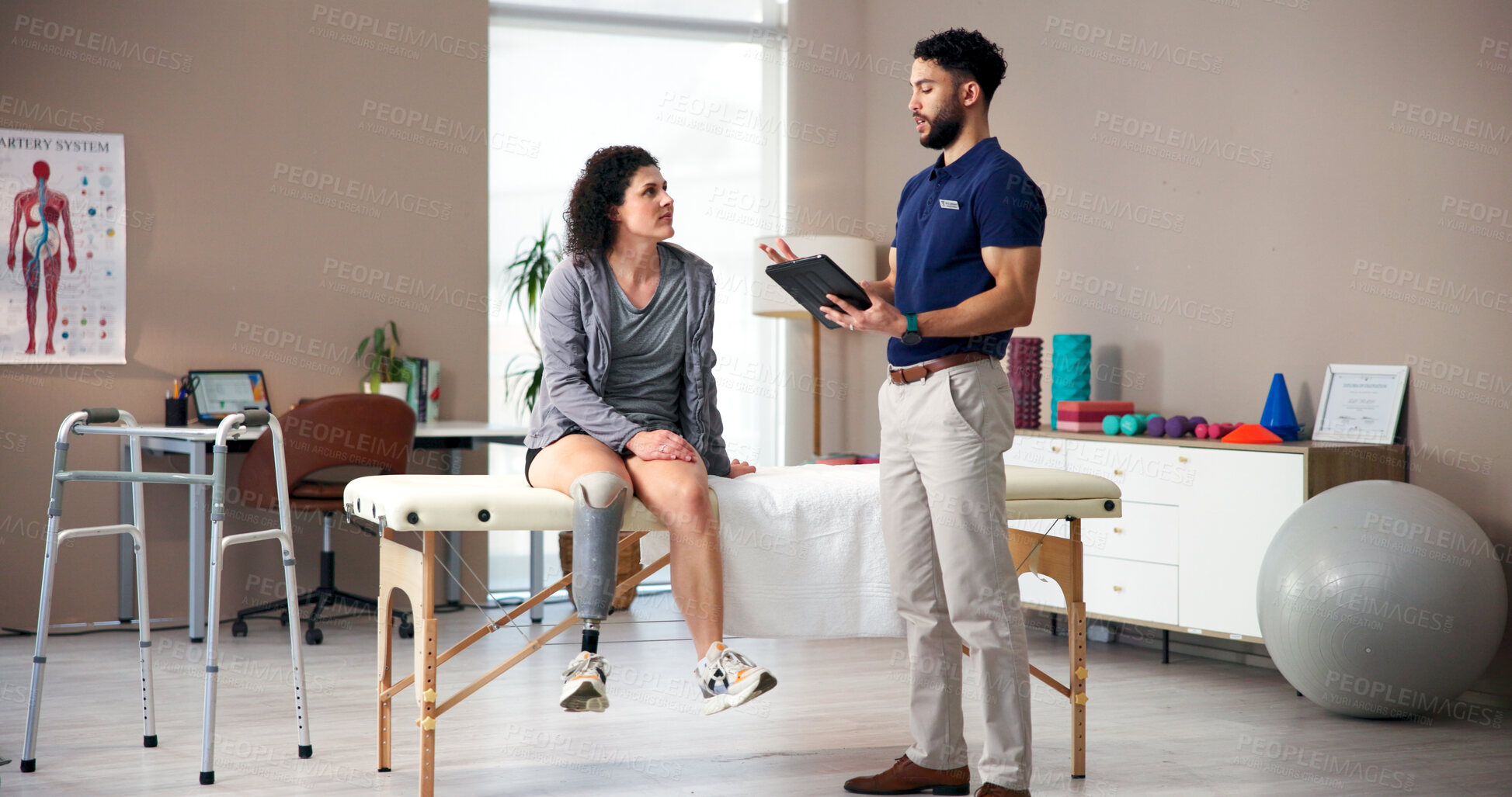Buy stock photo Physiotherapist, tablet and patient with prosthetic leg for consultation, checkup or exam in clinic. Man, therapist and talking to person with a disability on technology for muscle rehabilitation