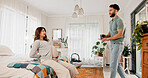 Pregnancy, couple and giving coffee in bedroom, back pain or help with morning beverage in home. Pregnant woman, man and herbal tea for support, care and discomfort with backache in maternity