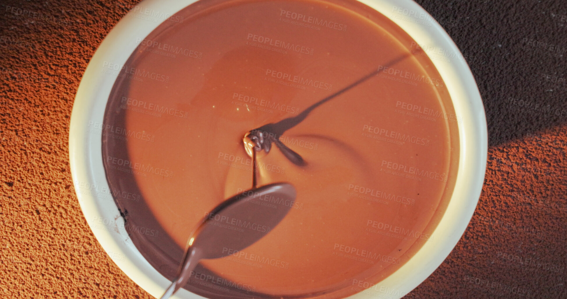 Buy stock photo Spoon, dripping and bowl with chocolate for production, smooth texture and tempered mixture for baking. Above, gourmet process and cocoa with utensil for dessert preparation, refined liquid or mixing