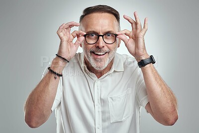 Buy stock photo Portrait, glasses and man with smile in studio, optometry and prescription frames for sight clarity. Happy, clear vision and mature person with eyewear for visual correction, see and white background