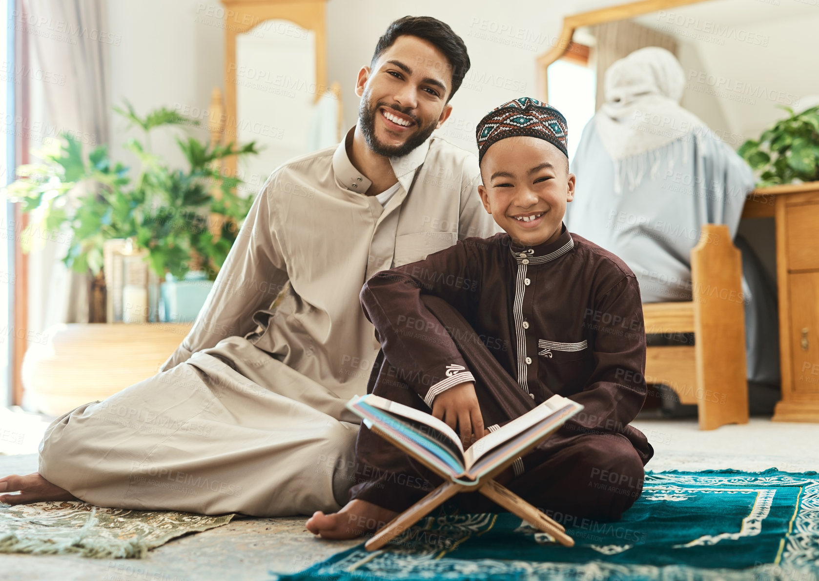 Buy stock photo Quran, portrait and muslim father with child in home studying religion for spiritual wellness together. Arabic, support and islamic dad with boy kid for worship, learning or knowledge on holy book.
