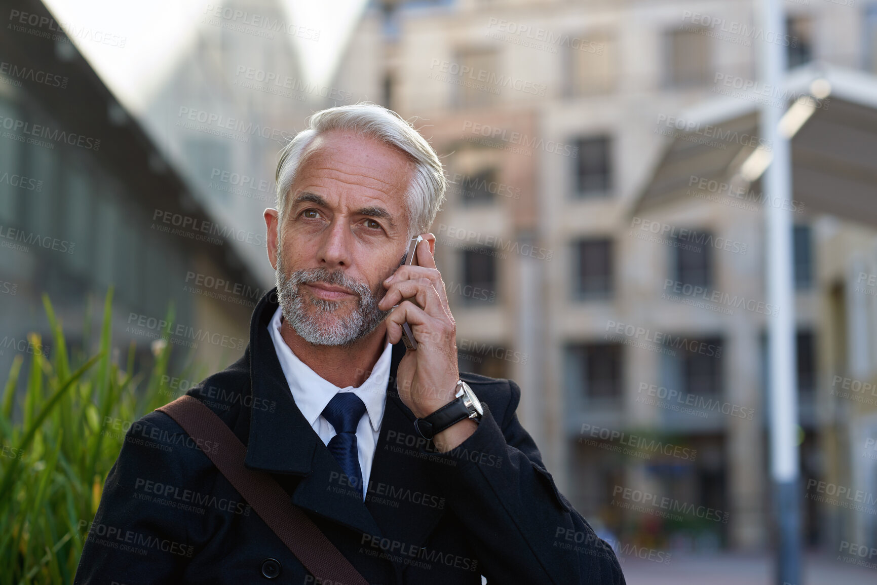 Buy stock photo Phone call, business and mature man in city for talking, discussion and contact on morning commute. Corporate, travel and person on smartphone for conversation, communication and networking in town