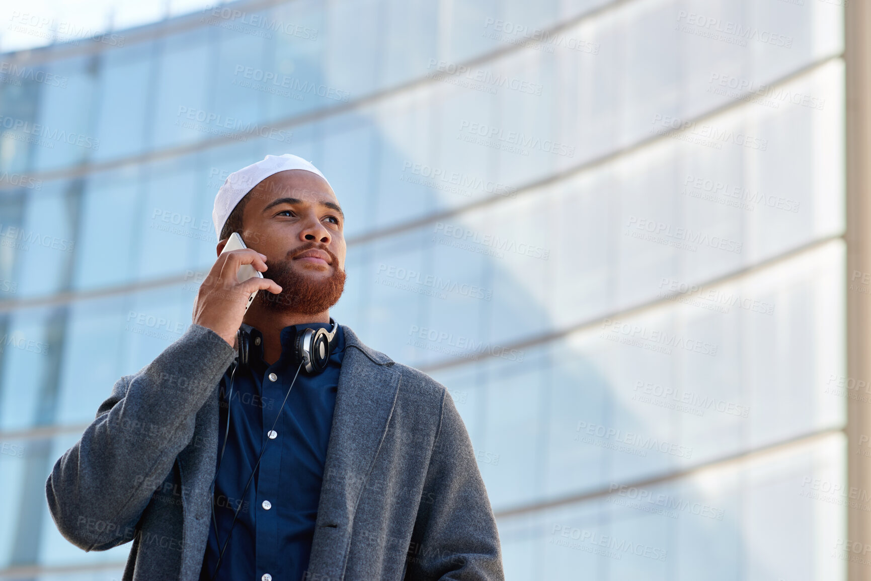 Buy stock photo Building, business and phone call with Muslim man in city for communication or update from below. Conversation, thinking and planning with Islamic employee outdoor for mobile feedback or negotiation