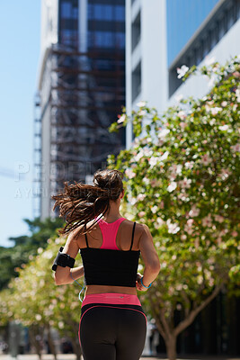 Buy stock photo Running, back and woman with fitness in city, morning cardio and endurance training for challenge. Workout, active and athlete with weekend jog for pace practice, aerobic exercise or wellness in town