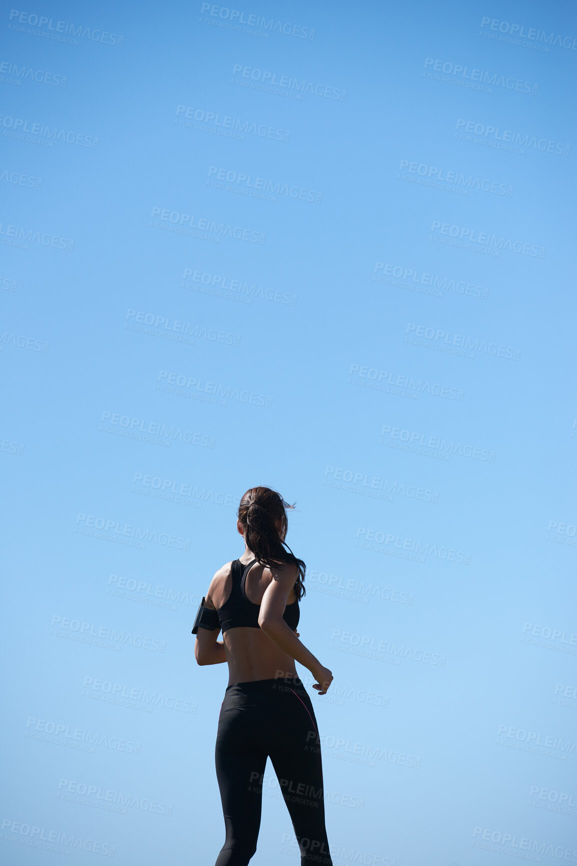 Buy stock photo Outdoor, runner and back of woman with fitness, morning cardio and endurance training for challenge. Workout, mockup space and athlete with jog for body goals, pace practice and aerobic exercise