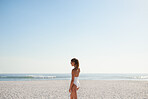 Stylish woman wearing full one piece bathing suite at beach