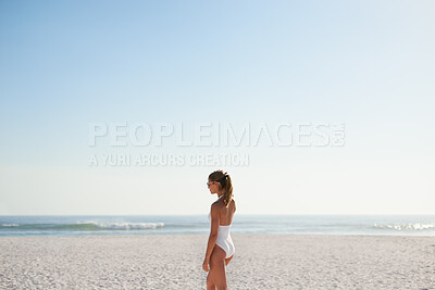 Buy stock photo Woman, walking and relax on beach with summer holiday, swimsuit and sunglasses for weekend getaway. Mockup space, female person and shades outdoor by ocean with peace, reflection or vacation in Miami