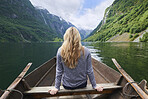 Adventure woman enjoying majestic river view from row boat epic landscape travel discover explore beautiful earth