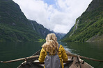 Adventure woman enjoying majestic river view from row boat epic landscape travel discover explore beautiful earth