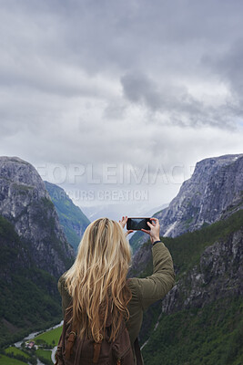 Buy stock photo Woman, adventure or mountain with phone for picture of landscape, outdoor memory or photography. Back view, female person or tourist with smartphone for travel or capture moment of natural scenery