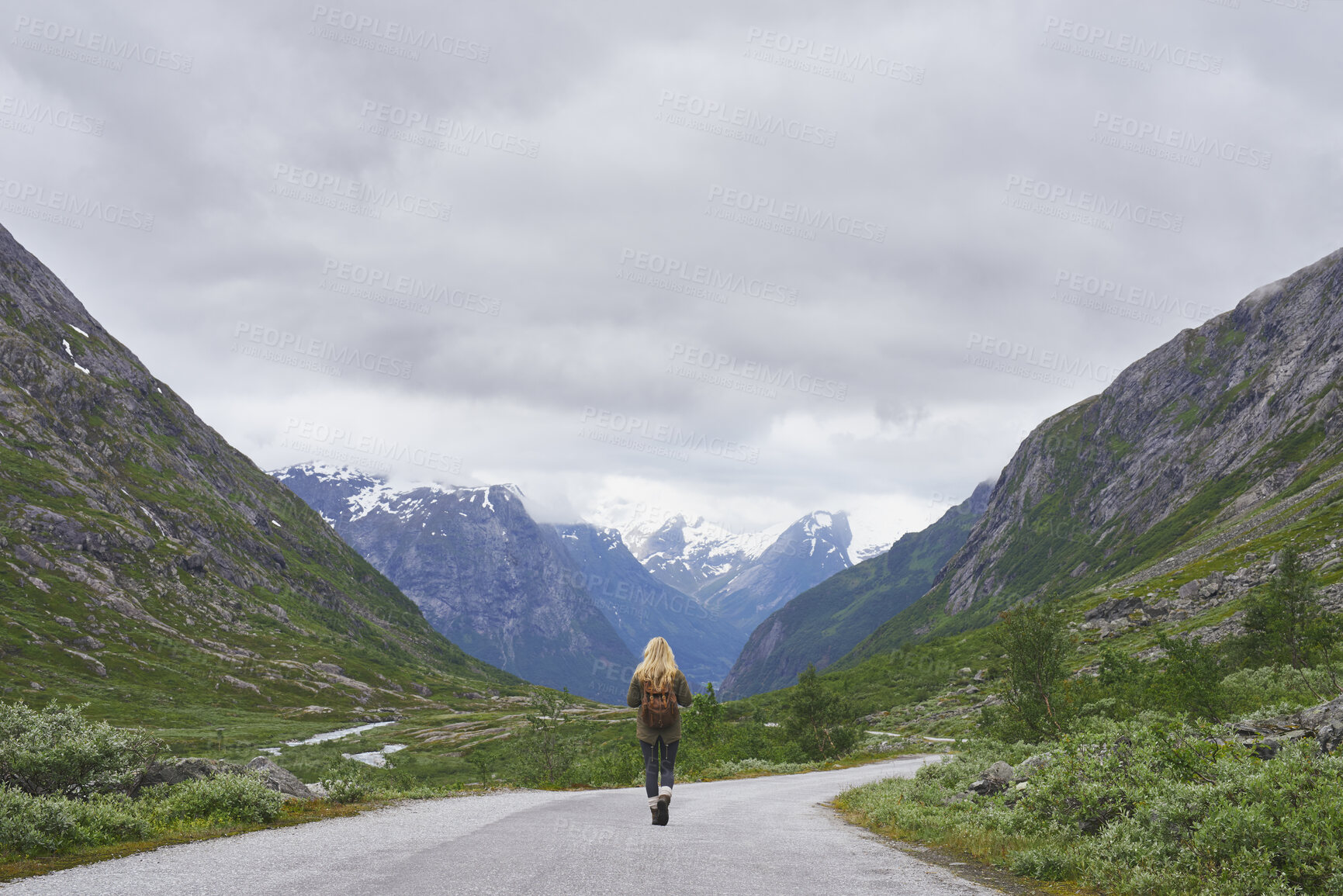 Buy stock photo Mountain, backpacking and woman on road for journey, mockup space and fresh air on adventure or travel. Outdoor, person and hiking on weekend, exploration and trekking with view of valley and scenery