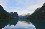 Majestic beautiful fjord landscape in Norway Fjord lake mountain snow water reflection glacial valley