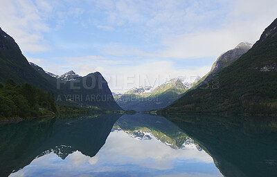 Buy stock photo Sky, mountain and landscape of ocean in nature for summer vacation, destination or holiday. Travel, clouds and sea by scenic natural view for outdoor weekend trip with sustainability location.