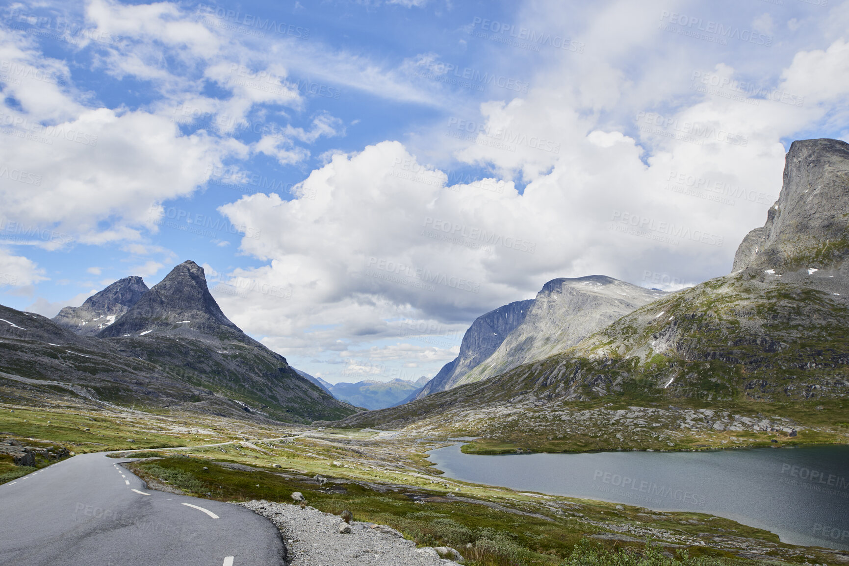 Buy stock photo Blue sky, mountain and clouds with road of landscape, valley or beautiful climate in nature. Empty, space and wilderness of river stream or street with greenery, snow or lake for outdoor destination