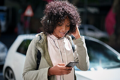 Buy stock photo Streaming, headphones or black woman in city with phone, song connection or listening to music playlist. Smile, digital or female person with tech, online track or radio subscription on audio app.